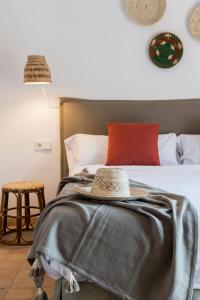 Łóżko lub łóżka w pokoju w obiekcie Curolla Petit Hotel
