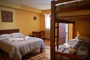 Postel nebo postele na pokoji v ubytování El Parche Rutero Hostel + 105 fotografií
