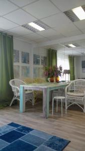 a dining room with a table and two chairs at Friedens apartment in Plauen