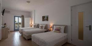 Postel nebo postele na pokoji v ubytování Caldera Romantica Hotel