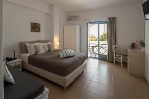 Postel nebo postele na pokoji v ubytování Caldera Romantica Hotel