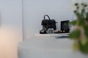 a counter with glasses and a coffee maker on it at Caldera Romantica Hotel in Akrotiri