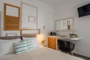 Postel nebo postele na pokoji v ubytování Caldera Romantica Hotel