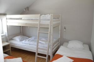 En eller flere senge i et værelse på Toscana Restaurant and Bed & Breakfast