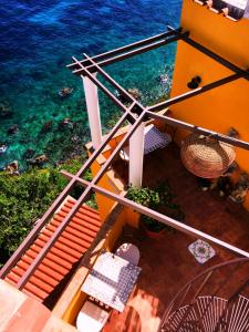 an overhead view of the ocean from a balcony at La Terrazza sul Mare in Capri