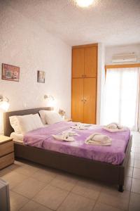 Postel nebo postele na pokoji v ubytování Gioma Hotel