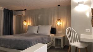 Ein Bett oder Betten in einem Zimmer der Unterkunft Galatia Villas