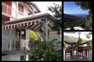 Casa con balcón con mesa y sillas en Chez Lucile et Gilbert, en Bouillante