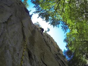 a person on a rope climbing a rock wall at Apartman Veronika in Starigrad-Paklenica