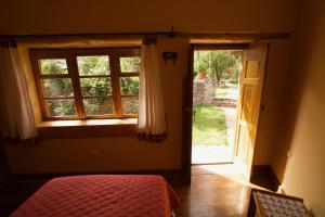 Postel nebo postele na pokoji v ubytování Casa De Aida