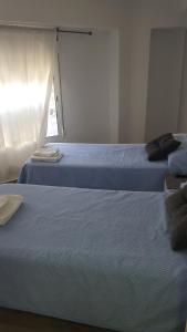 Postel nebo postele na pokoji v ubytování Guesthouse Central