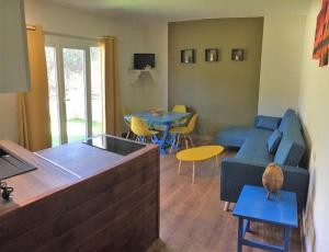 a living room with a couch and a table at MON FARE in Argelès-sur-Mer