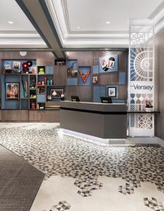 a lobby with a reception desk in a building at Hotel Versey Days Inn by Wyndham Chicago in Chicago