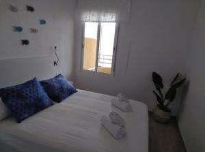 a bedroom with a bed with two towels on it at El Amanecer de Calpe 2 in Calpe