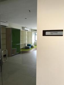 a door in a room with a hallway at Hyve Soho Family Resort Suites in Cyberjaya