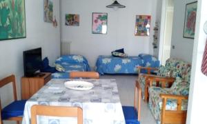 a living room with a table and a couch at Casa in SALENTO a Otranto in Otranto