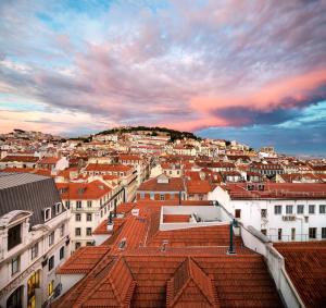 a view of a city with red roofs at Hotel do Chiado in Lisbon