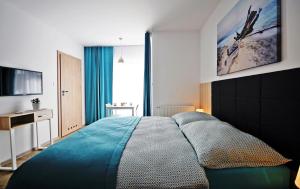 מיטה או מיטות בחדר ב-Villa Blanca