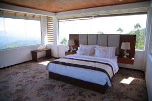 Tempat tidur dalam kamar di Bellwood Hills Resort & Spa