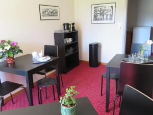 a dining room with two tables and two chairs at Landhaus an der Thur in Alt Sankt Johann +21 photos