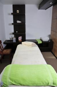 Giường trong phòng chung tại El Copihue Olmué