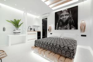 Posteľ alebo postele v izbe v ubytovaní Portara Seaside Luxury Suites