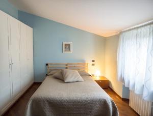 Postel nebo postele na pokoji v ubytování La Via Francigena B&B