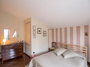 Postel nebo postele na pokoji v ubytování La Via Francigena B&B
