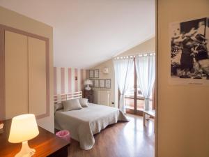 Postel nebo postele na pokoji v ubytování La Via Francigena B&B