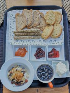 a lunch tray with bread and a bowl of food at Small Paradise in Andros
