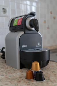 a coffee maker sitting on top of a counter at Kassiani Studios in Plakias