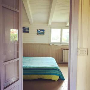 A bed or beds in a room at Lo Chalet dell'Artista