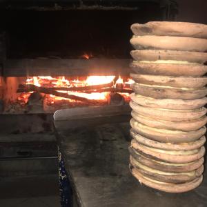 a stack of breads cooking in an oven at Hotel Mirador in Aulla