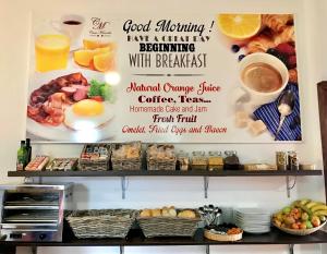 a sign on the wall of a bakery with breakfast food at Hostal Casa Mercedes in Nerja