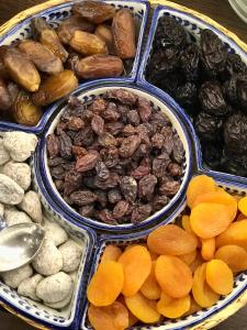 a tray of different types of nuts and dried fruits at Hostal Casa Mercedes in Nerja