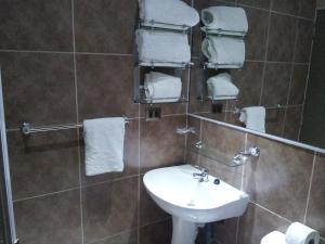 Ένα μπάνιο στο Hotel Astore Suites