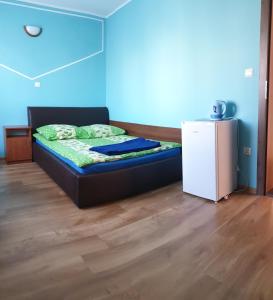 Łóżko lub łóżka w pokoju w obiekcie Pokoje Gościnne Pryzmat