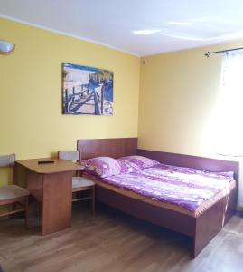 Łóżko lub łóżka w pokoju w obiekcie Pokoje Gościnne Pryzmat
