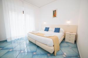 Postel nebo postele na pokoji v ubytování Hotel De Rosa