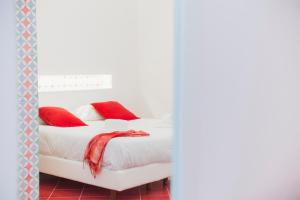 Postel nebo postele na pokoji v ubytování Hotel De Rosa