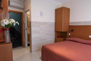 Postel nebo postele na pokoji v ubytování Hotel Real