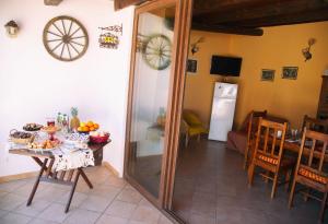 a dining room with a table and a mirror at B&B Il Girasole in Balestrate