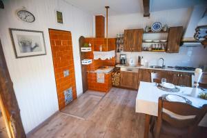 a small kitchen with a table and a counter top at Gaja-Białowieża in Wiluki