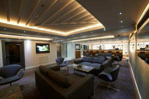 a large living room with couches and a tv at En Otel Karaca in Eskisehir