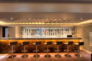 a bar in a hotel with stools at En Otel Karaca in Eskisehir