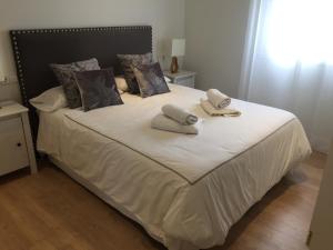 Łóżko lub łóżka w pokoju w obiekcie Penthouse Asuncion Feria
