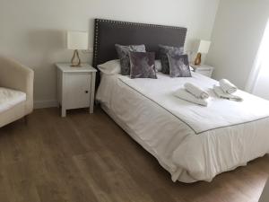Postel nebo postele na pokoji v ubytování Penthouse Asuncion Feria