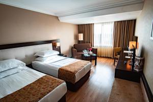 A bed or beds in a room at Eresin Hotels Topkapı
