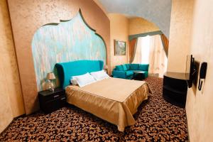 Postel nebo postele na pokoji v ubytování Khan-Chinar Hotel