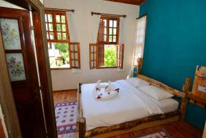 En eller flere senge i et værelse på Otel Wood House + 59 billeder